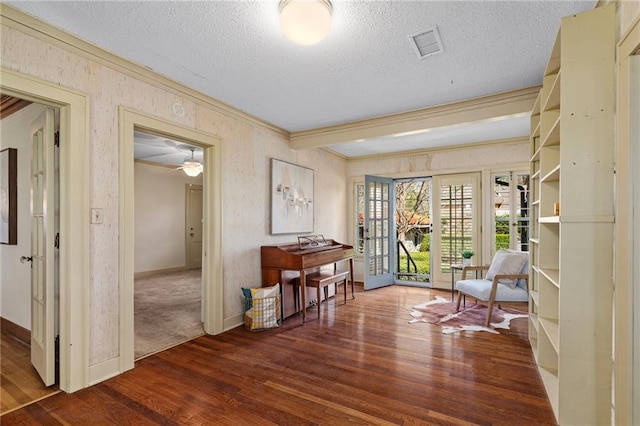 6721 Santa Fe Dr, Overland Park, KS 66204 - corridor with baseboards, ornamental molding, a textured ceiling, visible vents, and wood finished floors