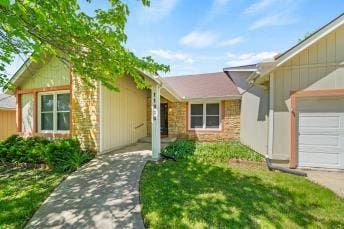 11930 Charlotte St, Kansas City, MO 64146 - single story home featuring stone siding and a garage