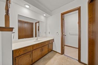 11930 Charlotte St, Kansas City, MO 64146 - bathroom with vanity, recessed lighting, and baseboards