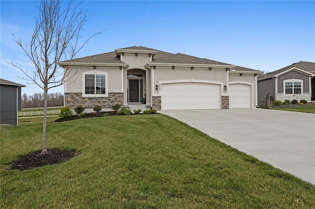 6604 NW 107th Ct, Kansas City, MO 64154 - view of front of home featuring driveway, stone siding, a garage, and stucco siding