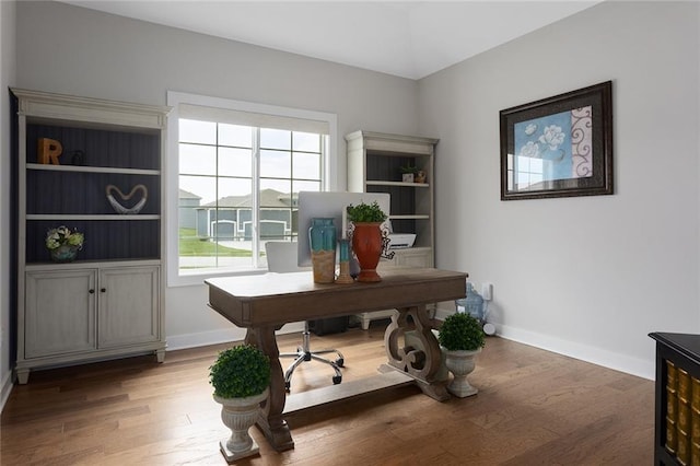 6604 NW 107th Ct, Kansas City, MO 64154 - office area with baseboards and wood finished floors