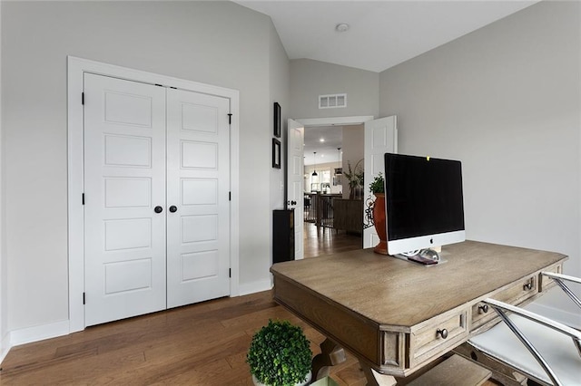 6604 NW 107th Ct, Kansas City, MO 64154 - office space with visible vents, baseboards, vaulted ceiling, and dark wood finished floors