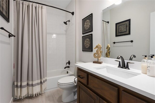 6604 NW 107th Ct, Kansas City, MO 64154 - full bath with toilet, shower / bath combo with shower curtain, and vanity
