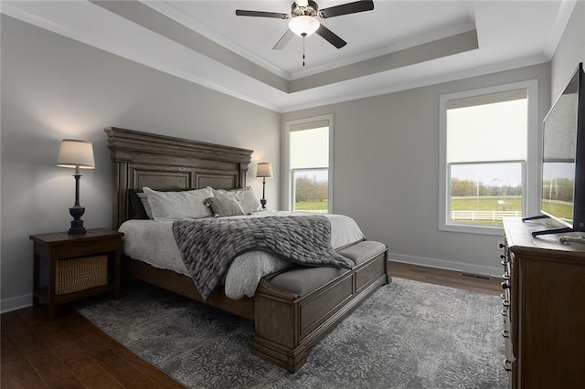 6604 NW 107th Ct, Kansas City, MO 64154 - bedroom with a raised ceiling, baseboards, ornamental molding, and dark wood finished floors