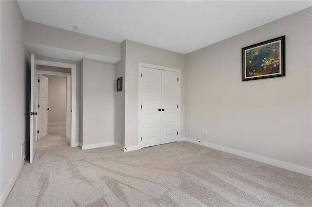 6604 NW 107th Ct, Kansas City, MO 64154 - unfurnished bedroom featuring light carpet, a closet, and baseboards