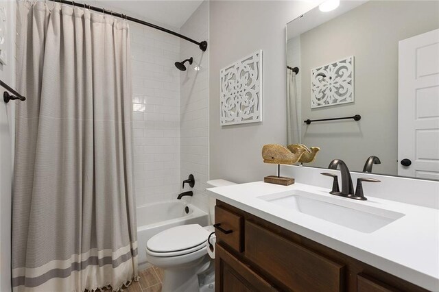 6604 NW 107th Ct, Kansas City, MO 64154 - bathroom with shower / tub combo, toilet, and vanity