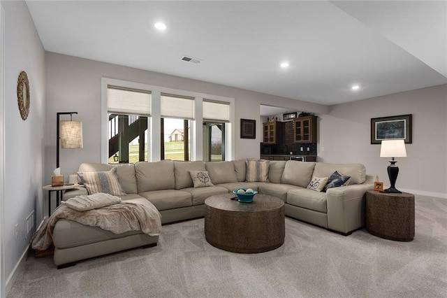 6604 NW 107th Ct, Kansas City, MO 64154 - living area featuring light colored carpet, baseboards, visible vents, and recessed lighting