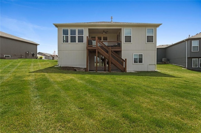 6604 NW 107th Ct, Kansas City, MO 64154 - rear view of property featuring a yard, ceiling fan, and stairway
