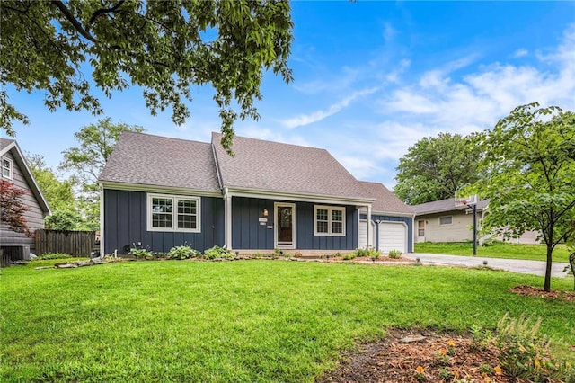 3600 W 48th St, Roeland Park, KS 66205 - view of front of house featuring board and batten siding, an attached garage, a porch, concrete driveway, and a shingled roof