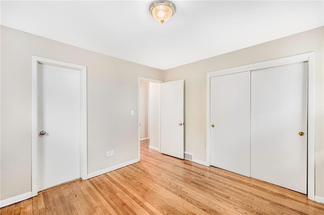 3600 W 48th St, Roeland Park, KS 66205 - unfurnished bedroom featuring light wood-style flooring and baseboards