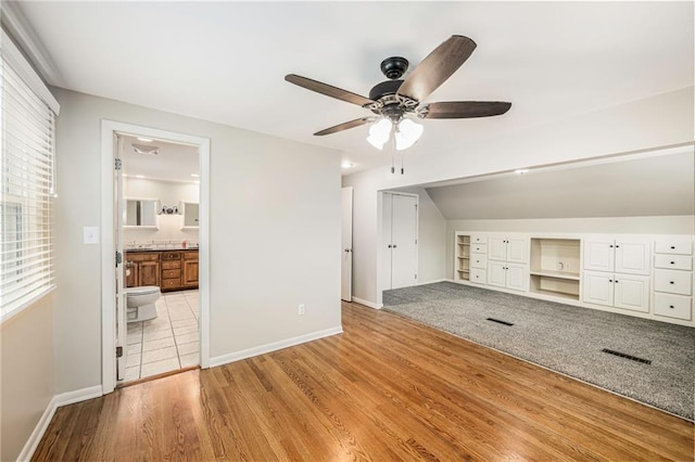 3600 W 48th St, Roeland Park, KS 66205 - unfurnished living room featuring a ceiling fan, baseboards, light wood-style floors, and plenty of natural light