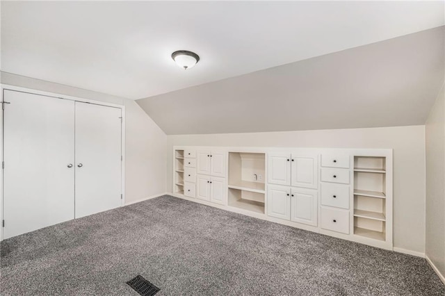 3600 W 48th St, Roeland Park, KS 66205 - additional living space featuring carpet floors, vaulted ceiling, built in shelves, and baseboards