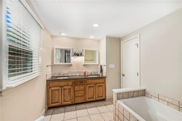 3600 W 48th St, Roeland Park, KS 66205 - full bath with double vanity, a garden tub, tile patterned floors, crown molding, and recessed lighting