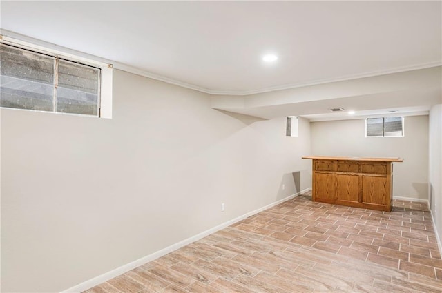3600 W 48th St, Roeland Park, KS 66205 - below grade area featuring a bar, light wood-style flooring, baseboards, and recessed lighting