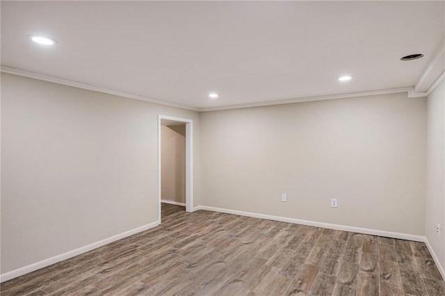 3600 W 48th St, Roeland Park, KS 66205 - finished below grade area with wood finished floors, crown molding, recessed lighting, and baseboards