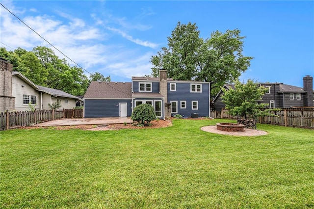 3600 W 48th St, Roeland Park, KS 66205 - back of house featuring an outdoor fire pit, a patio area, and a chimney