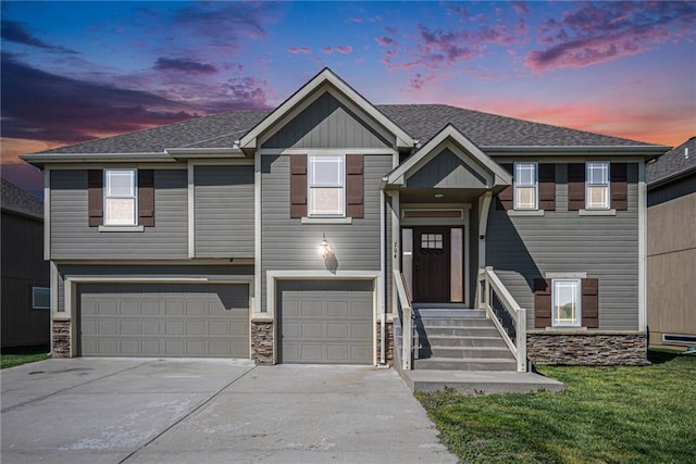 view of front of house featuring a garage, stone siding, and concrete driveway