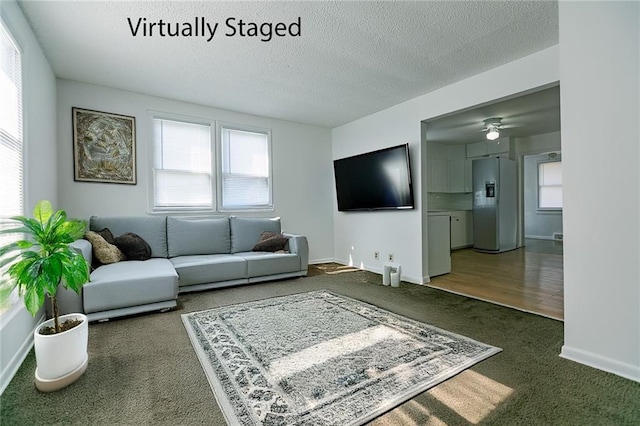 6936 Kensington Ave, Kansas City, MO 64132 - living area with carpet flooring, a ceiling fan, a textured ceiling, and baseboards