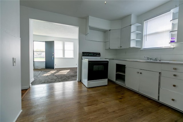 6936 Kensington Ave, Kansas City, MO 64132 - kitchen featuring open shelves, electric stove, white cabinets, and dark wood-type flooring
