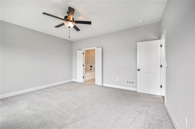 19703 W 196th St, Spring Hill, KS 66083 - unfurnished bedroom featuring light carpet, ensuite bath, and a ceiling fan
