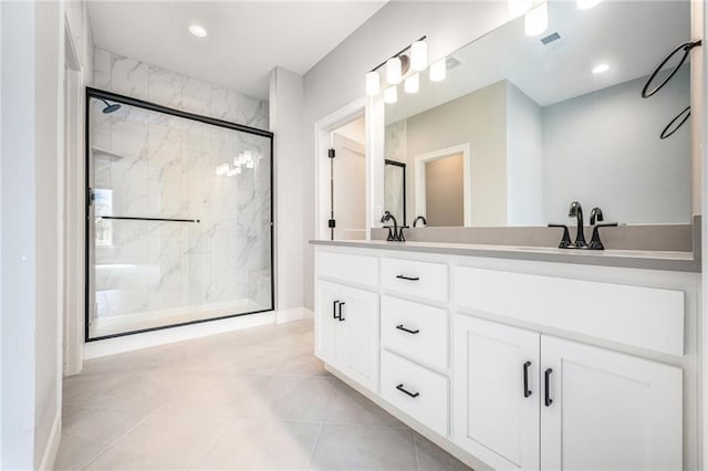 19703 W 196th St, Spring Hill, KS 66083 - full bath featuring a marble finish shower, double vanity, recessed lighting, and tile patterned floors