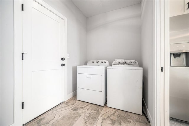 19703 W 196th St, Spring Hill, KS 66083 - laundry room with washer and clothes dryer and light marble finish flooring