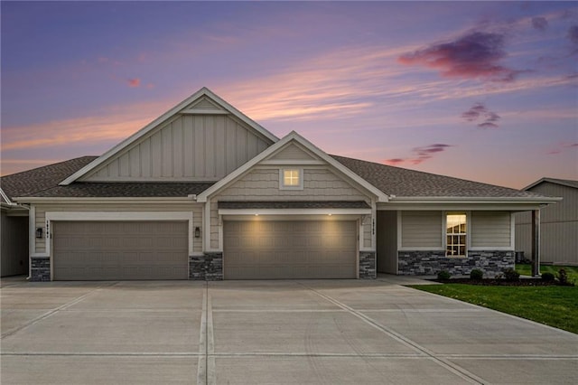 19703 W 196th St, Spring Hill, KS 66083 - view of front of house with a garage, board and batten siding, concrete driveway, and stone siding