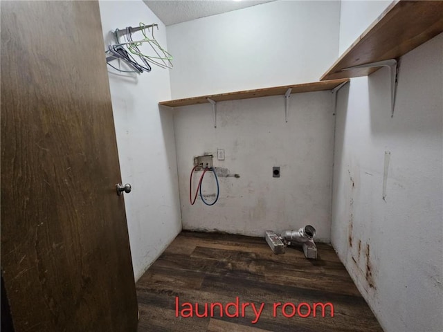 415 N Western St, Girard, KS 66762 - laundry room featuring laundry area, wood finished floors, washer hookup, and hookup for an electric dryer