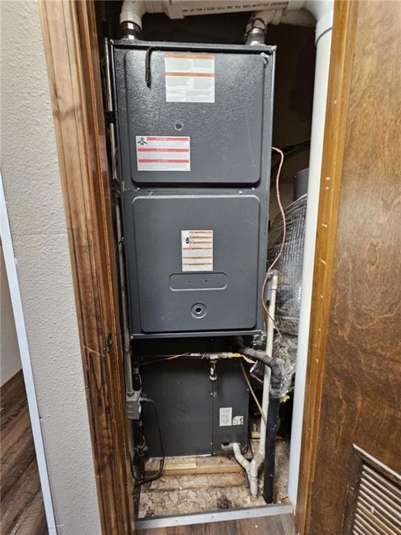 415 N Western St, Girard, KS 66762 - utility room with heating unit