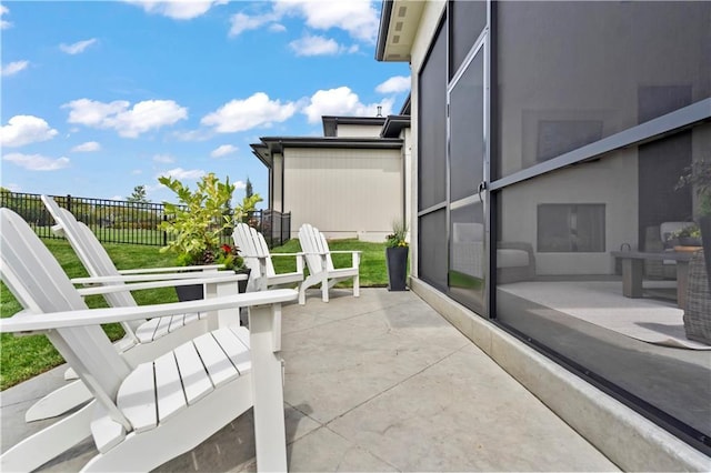 view of patio featuring fence