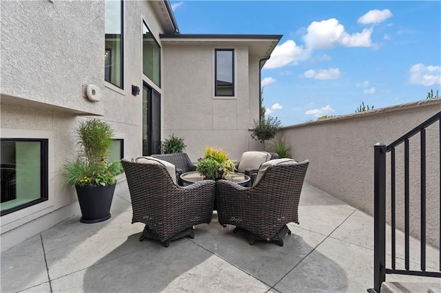 view of patio with fence and outdoor dining area