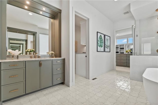 4506 W 136th Ter, Leawood, KS 66224 - full bath featuring a freestanding bath, vanity, tile patterned floors, baseboards, and recessed lighting