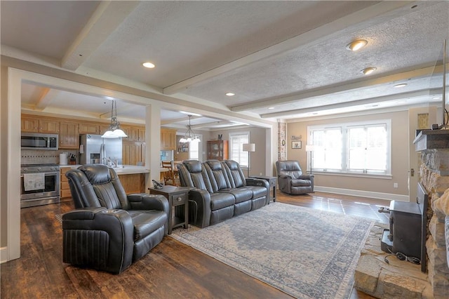 living room with baseboards, an inviting chandelier, beam ceiling, and dark wood finished floors