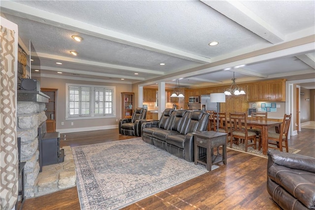 living area with baseboards and wood finished floors