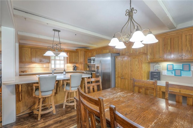 dining room with a notable chandelier, dark wood-style flooring, and beam ceiling
