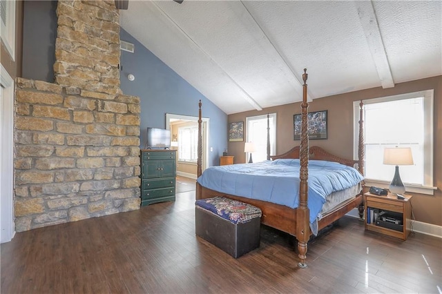 bedroom with lofted ceiling with beams, a textured ceiling, visible vents, baseboards, and dark wood-style floors