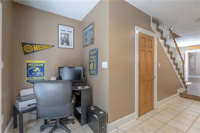 home office featuring light tile patterned floors and baseboards