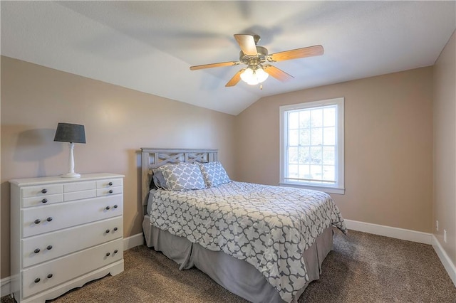 bedroom with dark carpet, baseboards, ceiling fan, and vaulted ceiling