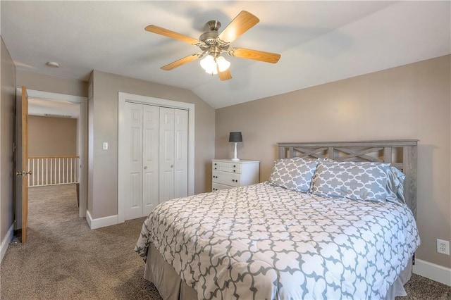 carpeted bedroom with a closet, baseboards, a ceiling fan, and lofted ceiling