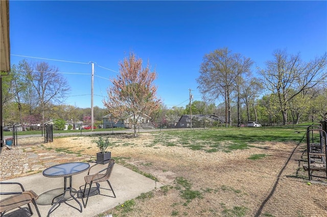 view of yard featuring a patio area and fence