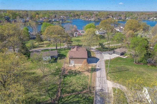 drone / aerial view featuring a water view and a residential view