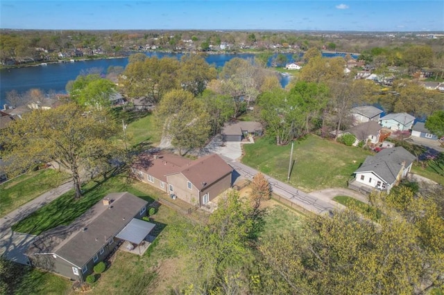 birds eye view of property with a water view and a residential view