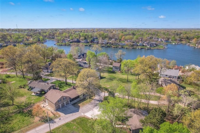drone / aerial view featuring a residential view and a water view