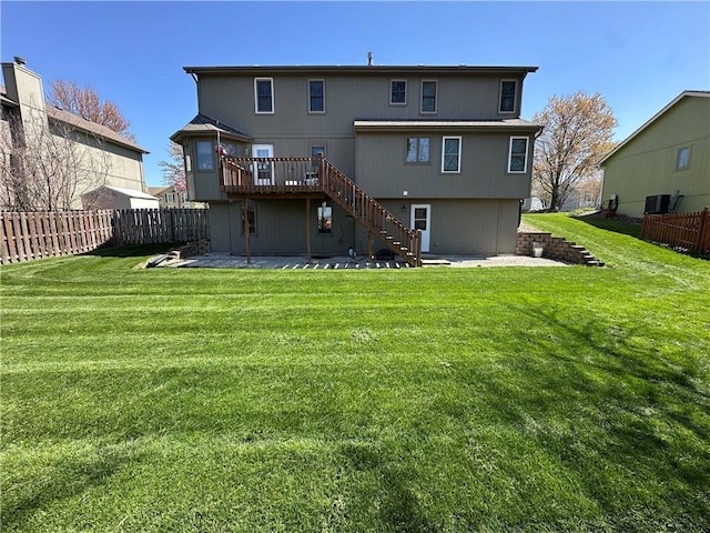 1200 Susan St, Kearney, MO 64060 - back of house featuring stairs, a wooden deck, and a patio area