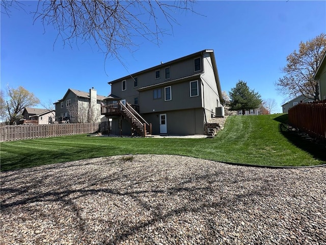 1200 Susan St, Kearney, MO 64060 - rear view of house with stairway and central air condition unit