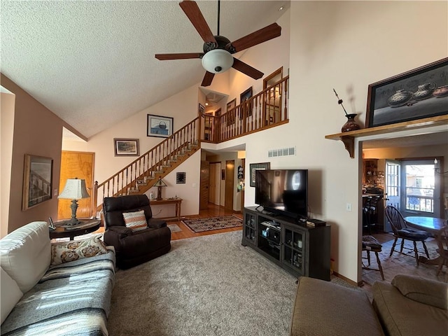 1200 Susan St, Kearney, MO 64060 - living area featuring high vaulted ceiling, stairs, ceiling fan, a textured ceiling, and wood finished floors
