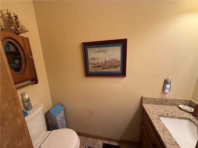 1200 Susan St, Kearney, MO 64060 - bathroom featuring toilet, vanity, and baseboards