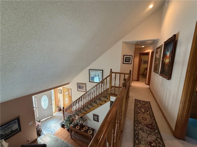 1200 Susan St, Kearney, MO 64060 - staircase featuring a textured ceiling and high vaulted ceiling