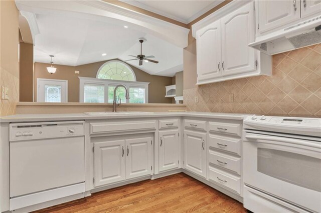 5428 W 145th Ter, Leawood, KS 66224 - kitchen with white appliances, extractor fan, light countertops, ceiling fan, and white cabinets