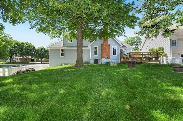 back of house with a wooden deck